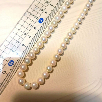 Akoya pearl necklace featuring white pink 6mm pearls strung on a 42cm chain