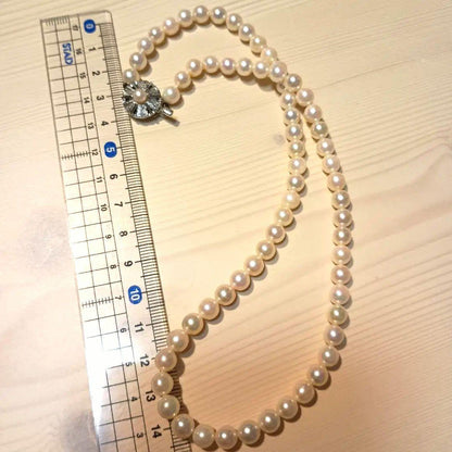 Akoya pearl necklace featuring white pink 6mm pearls strung on a 42cm chain