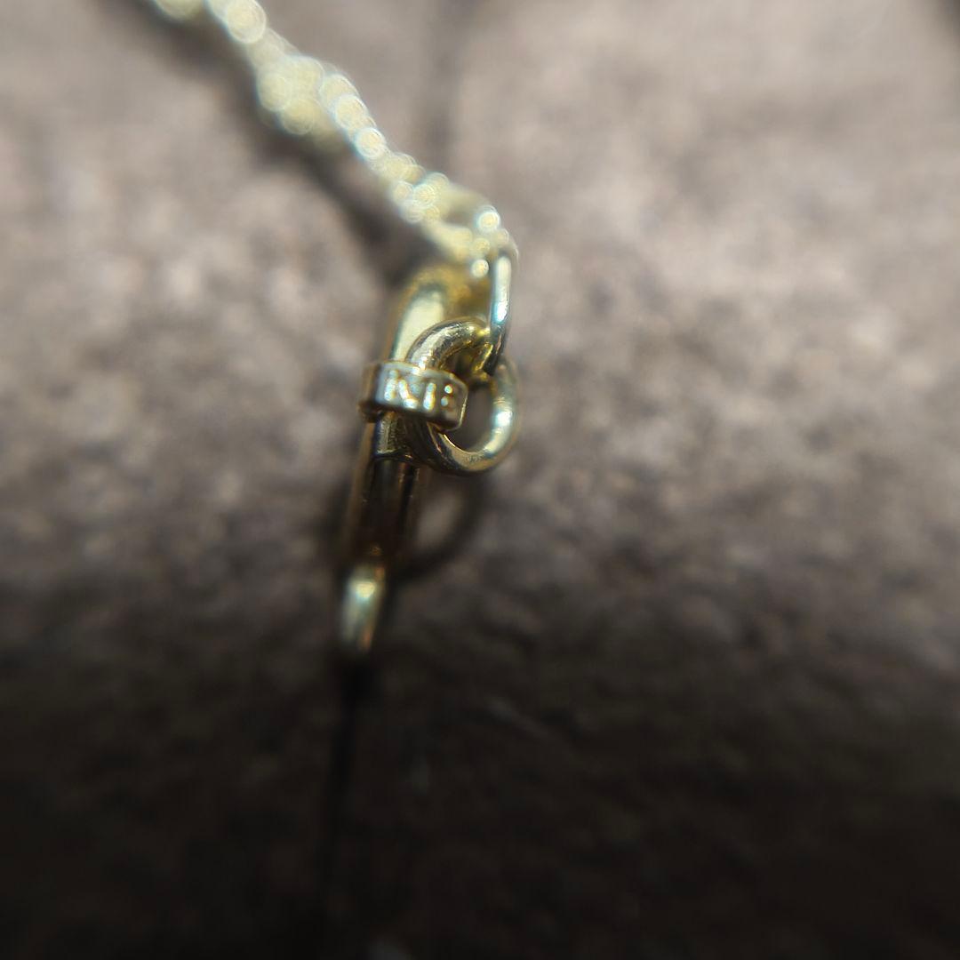 Close-up of Agate K18 screw chain necklace with 41cm length on white background