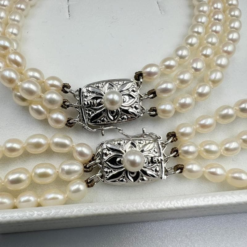 MiMOTO 3-strand silver necklace and bracelet set featuring 4mm pearls on a white background