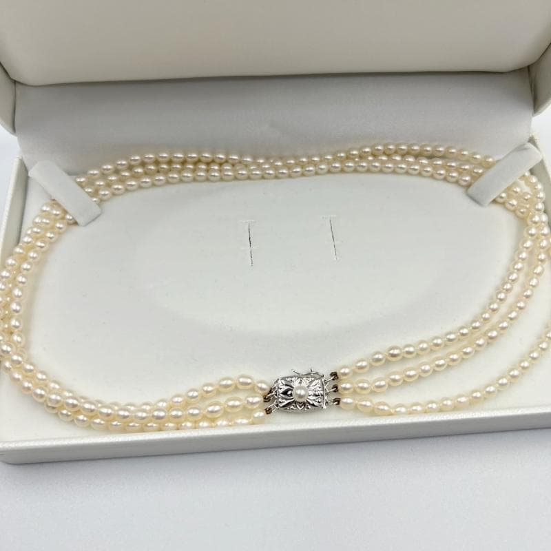 MiMOTO 3-strand silver necklace and bracelet set featuring 4mm pearls on a white background