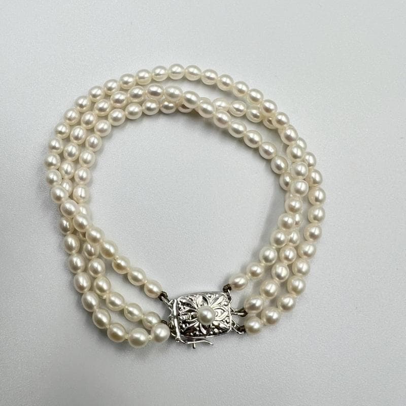 MiMOTO 3-strand silver necklace and bracelet set featuring 4mm pearls on a white background