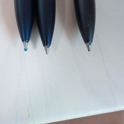 Pilot Drive 3-piece stationery set showing one pen with cover and two pens without covers