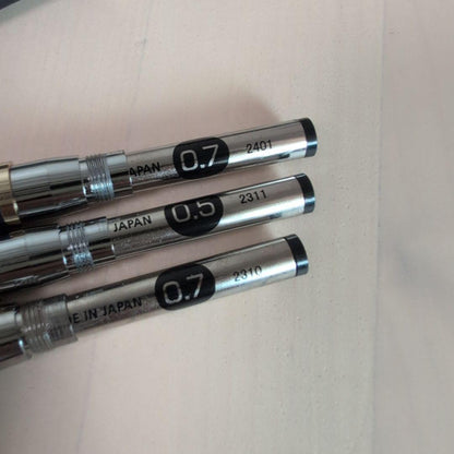 Pilot Drive 3-piece stationery set showing one pen with cover and two pens without covers