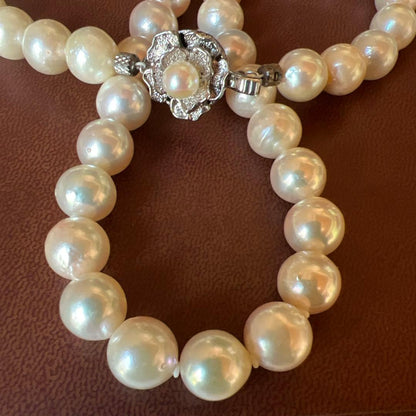 White pearl necklace with 8mm pearls and silver clasp, 40cm length, displayed on a white background