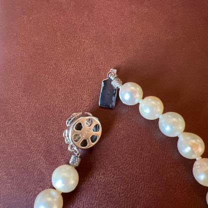 White pearl necklace with 8mm pearls and silver clasp, 40cm length, displayed on a white background