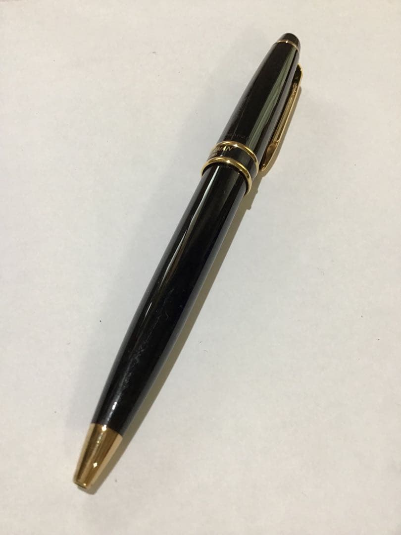 Waterman Paris black and gold ballpoint pen with leather case on white background
