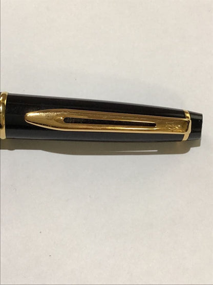 Waterman Paris black and gold ballpoint pen with leather case on white background