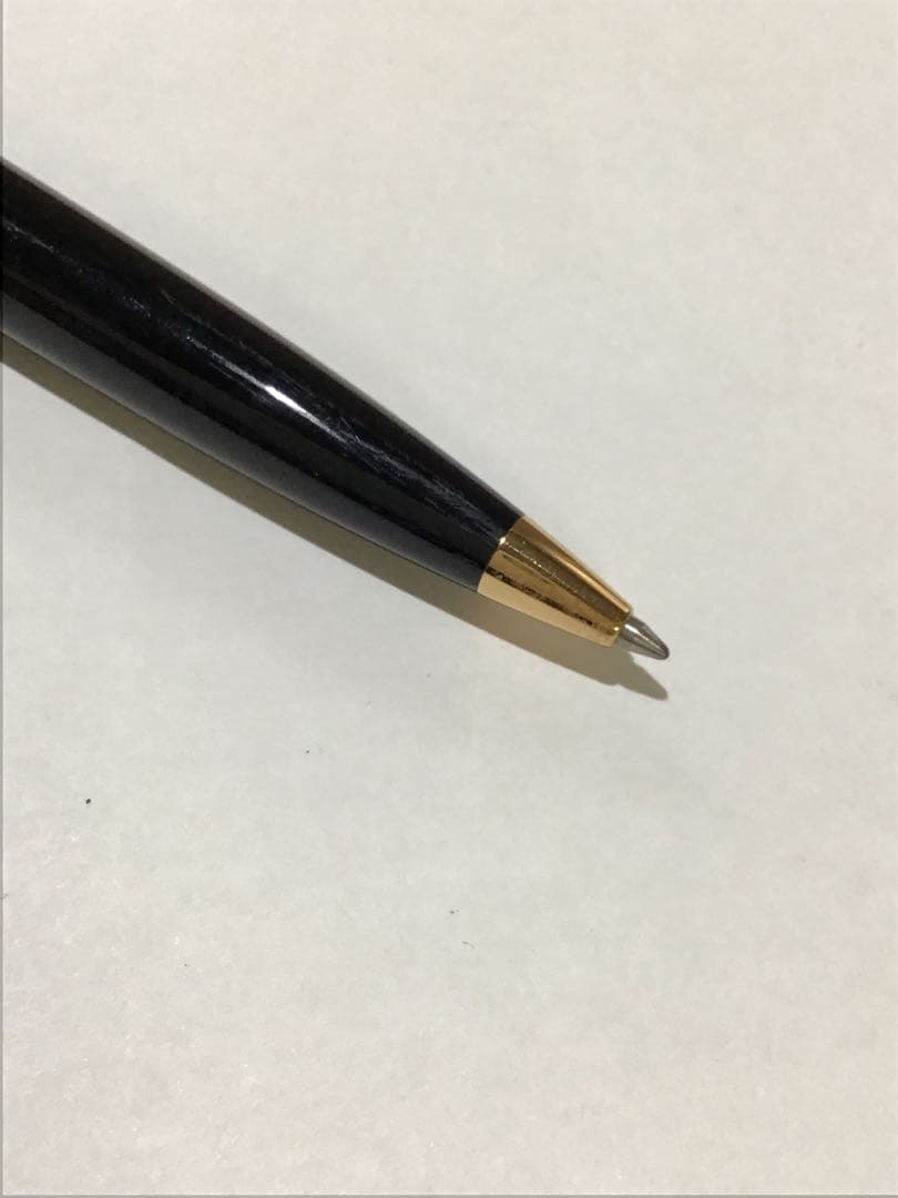 Waterman Paris black and gold ballpoint pen with leather case on white background