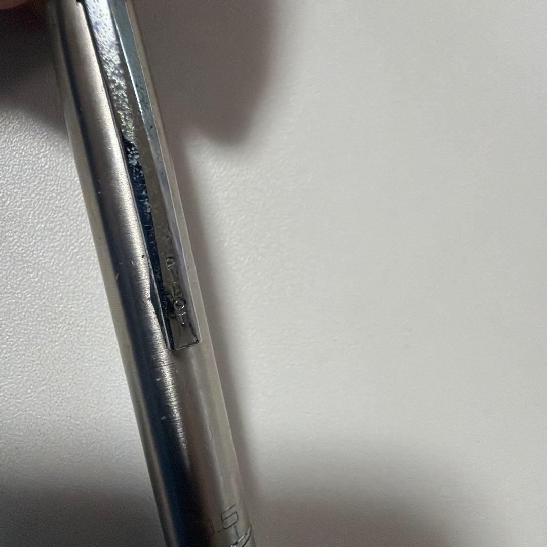 Vintage PILOT silver mechanical pencil with slim metal body and clip on a white background