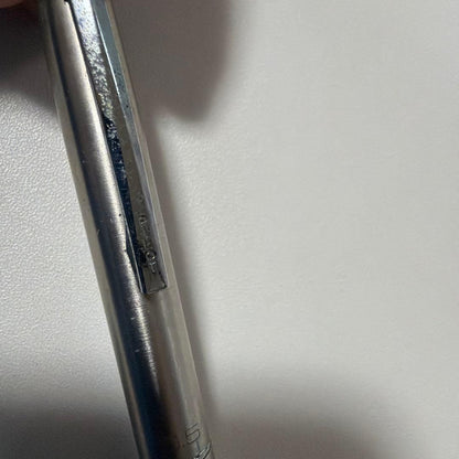 Vintage PILOT silver mechanical pencil with slim metal body and clip on a white background