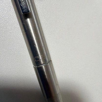 Vintage PILOT silver mechanical pencil with slim metal body and clip on a white background