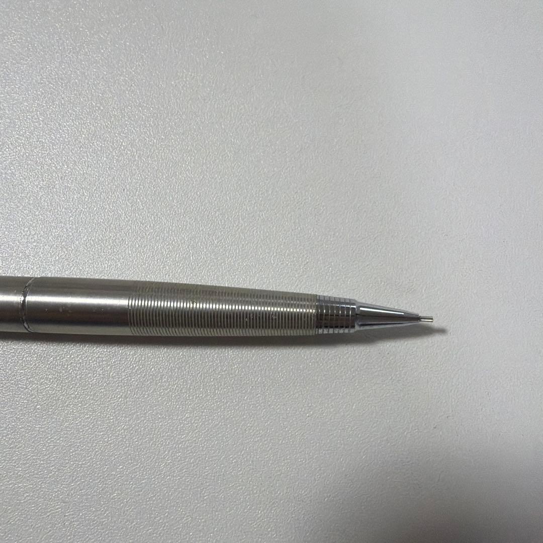 Vintage PILOT silver mechanical pencil with slim metal body and clip on a white background