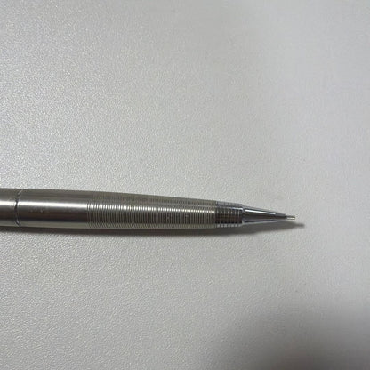 Vintage PILOT silver mechanical pencil with slim metal body and clip on a white background
