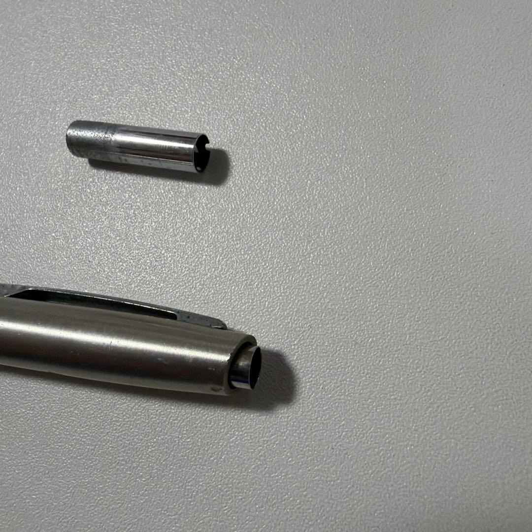 Vintage PILOT silver mechanical pencil with slim metal body and clip on a white background