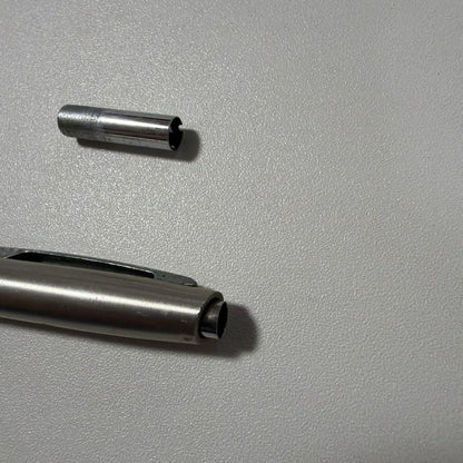 Vintage PILOT silver mechanical pencil with slim metal body and clip on a white background