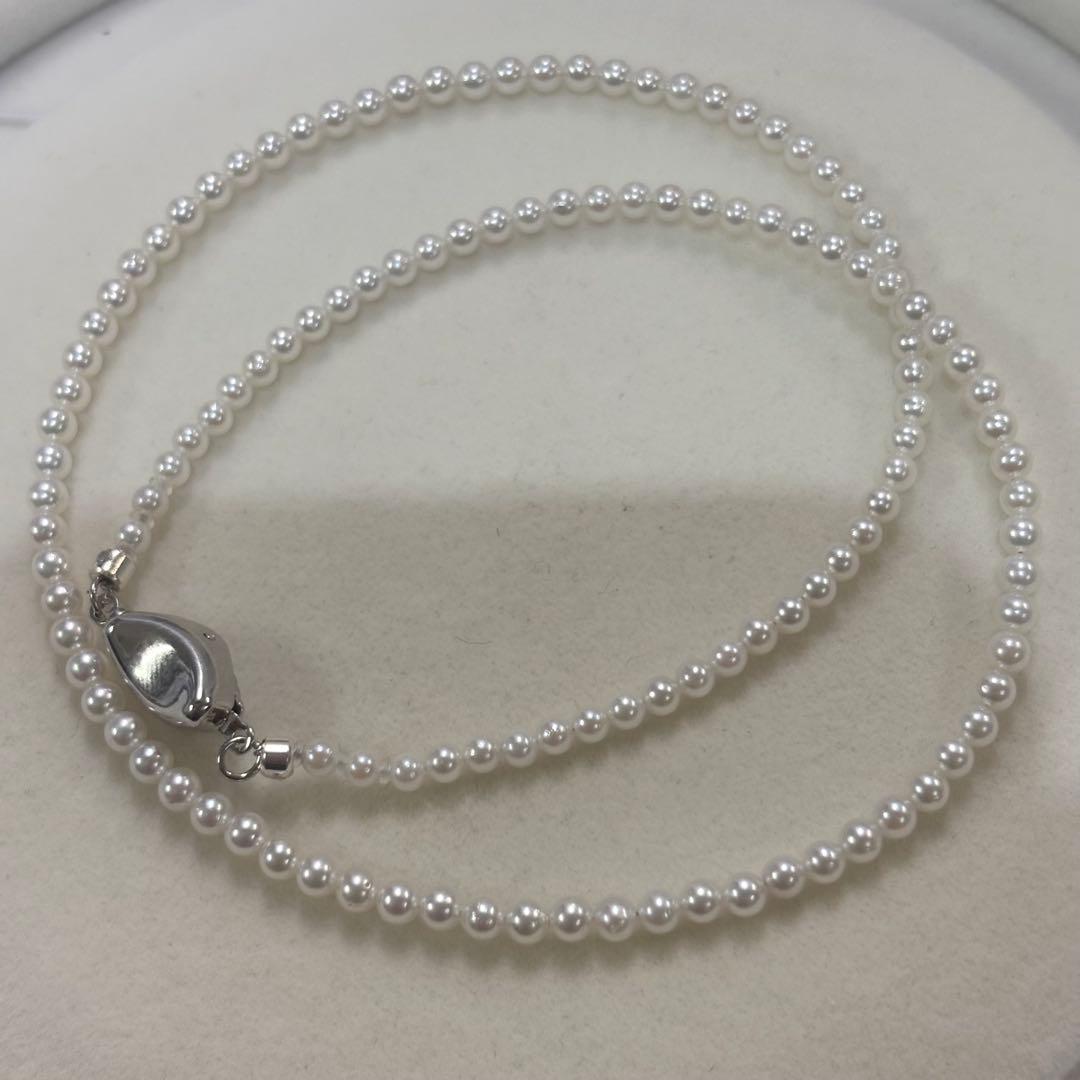 Akoya pearl necklace with uncoated 3-3.5mm baby pearls and 42cm length featuring a 925 marked clasp