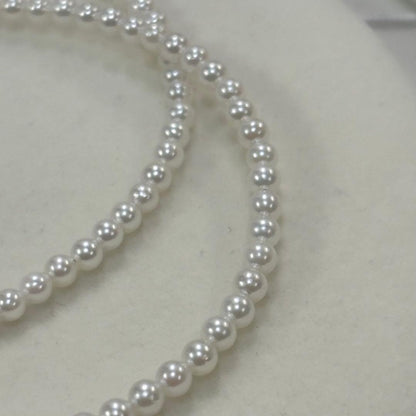 Akoya pearl necklace with uncoated 3-3.5mm baby pearls and 42cm length featuring a 925 marked clasp