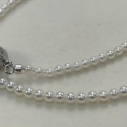 Akoya pearl necklace with uncoated 3-3.5mm baby pearls and 42cm length featuring a 925 marked clasp