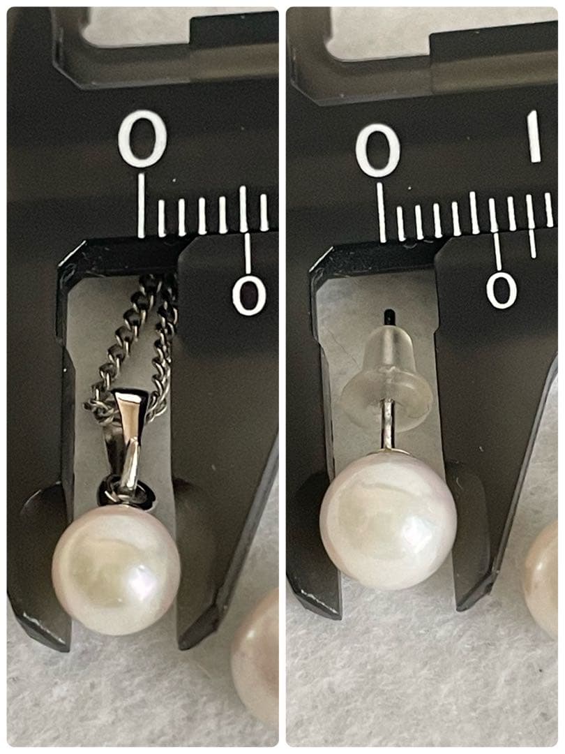 Akoya pearl necklace, earrings, and pendant set with white round pearls and silver chains on white background