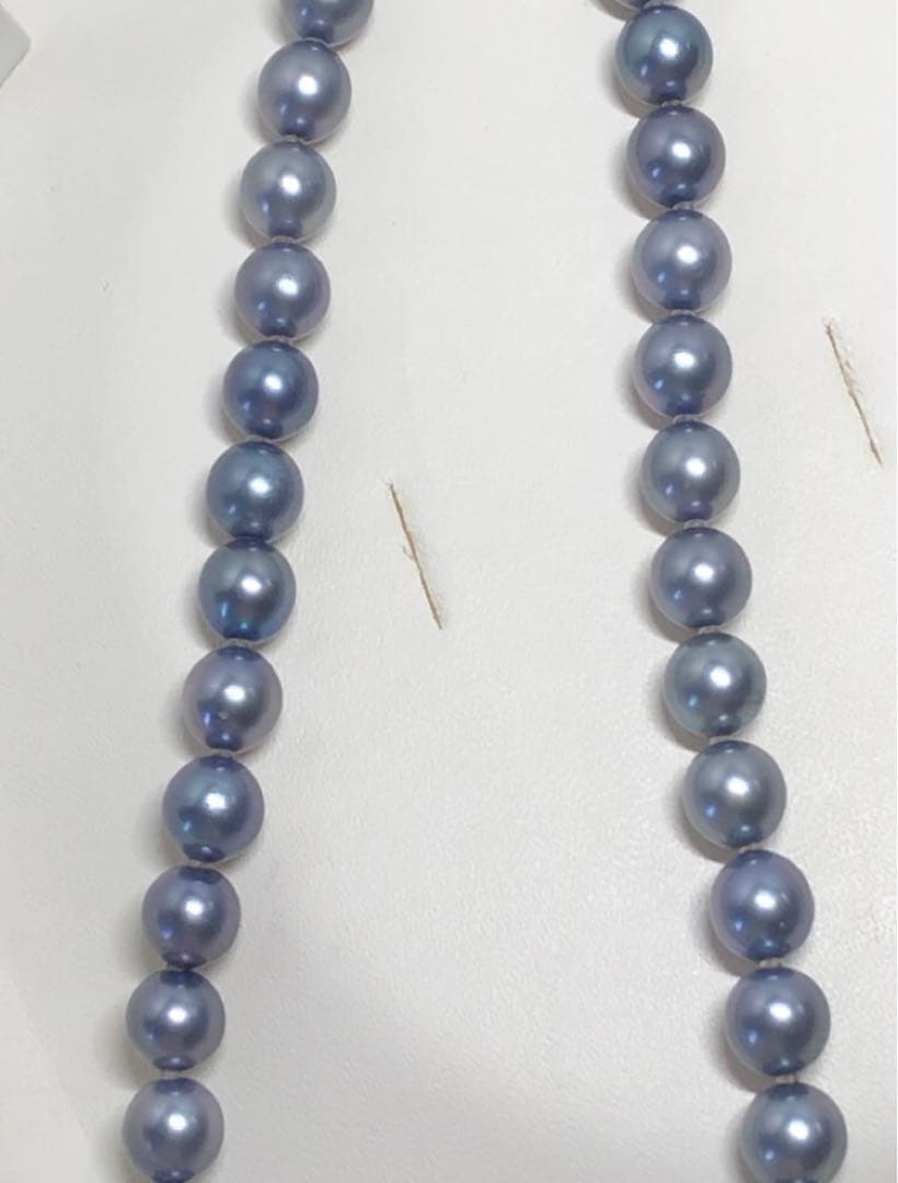 Akoya pearl necklace featuring 8mm semi-round gray pearls with blue and purple hues and silver one-push clasp