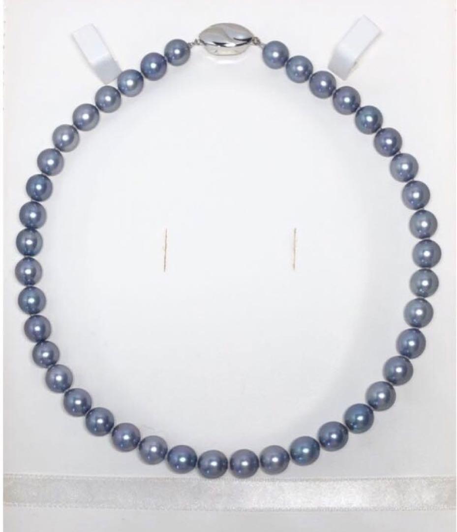 Akoya pearl necklace featuring 8mm semi-round gray pearls with blue and purple hues and silver one-push clasp