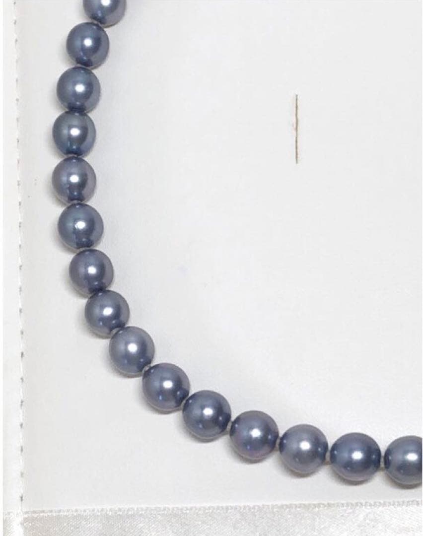 Akoya pearl necklace featuring 8mm semi-round gray pearls with blue and purple hues and silver one-push clasp