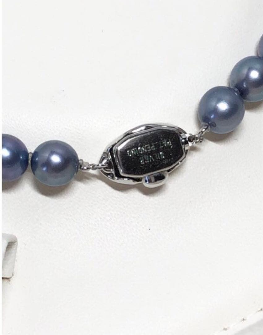 Akoya pearl necklace featuring 8mm semi-round gray pearls with blue and purple hues and silver one-push clasp