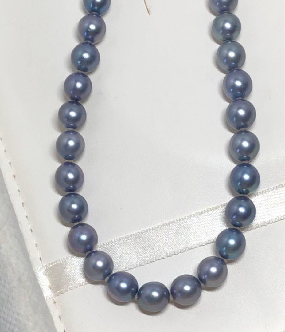 Akoya pearl necklace featuring 8mm semi-round gray pearls with blue and purple hues and silver one-push clasp