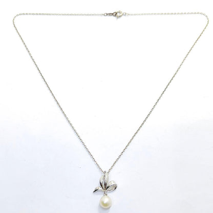 Mikimoto pearl necklace with 6.7mm pearls featuring ribbon, flower, and leaf silver design on 40cm chain