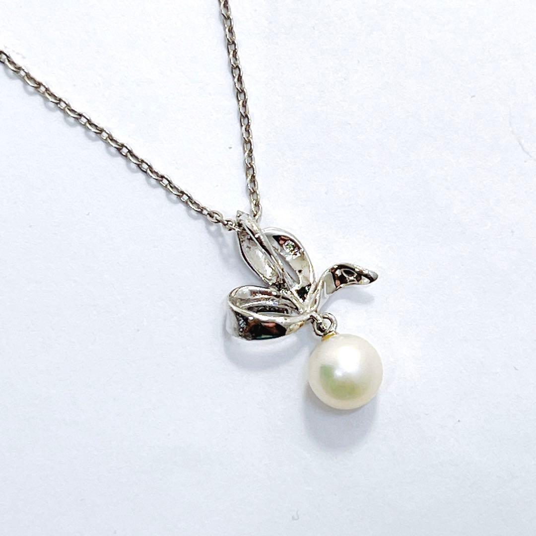Mikimoto pearl necklace with 6.7mm pearls featuring ribbon, flower, and leaf silver design on 40cm chain