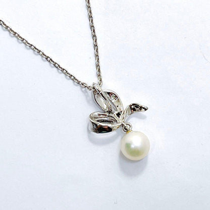 Mikimoto pearl necklace with 6.7mm pearls featuring ribbon, flower, and leaf silver design on 40cm chain