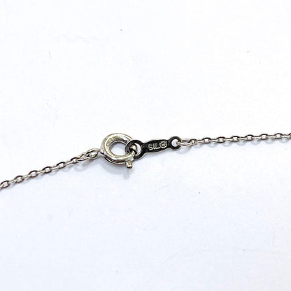 Mikimoto pearl necklace with 6.7mm pearls featuring ribbon, flower, and leaf silver design on 40cm chain