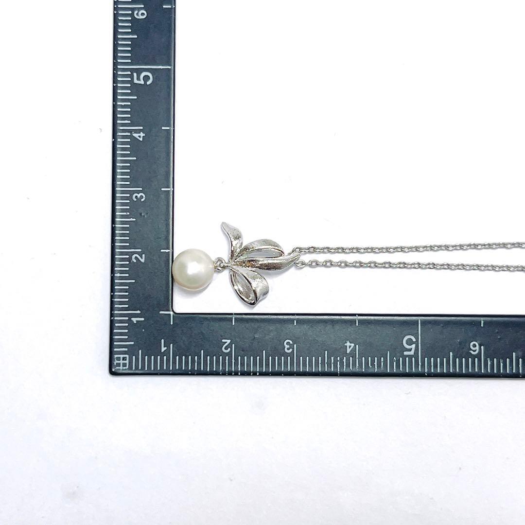 Mikimoto pearl necklace with 6.7mm pearls featuring ribbon, flower, and leaf silver design on 40cm chain
