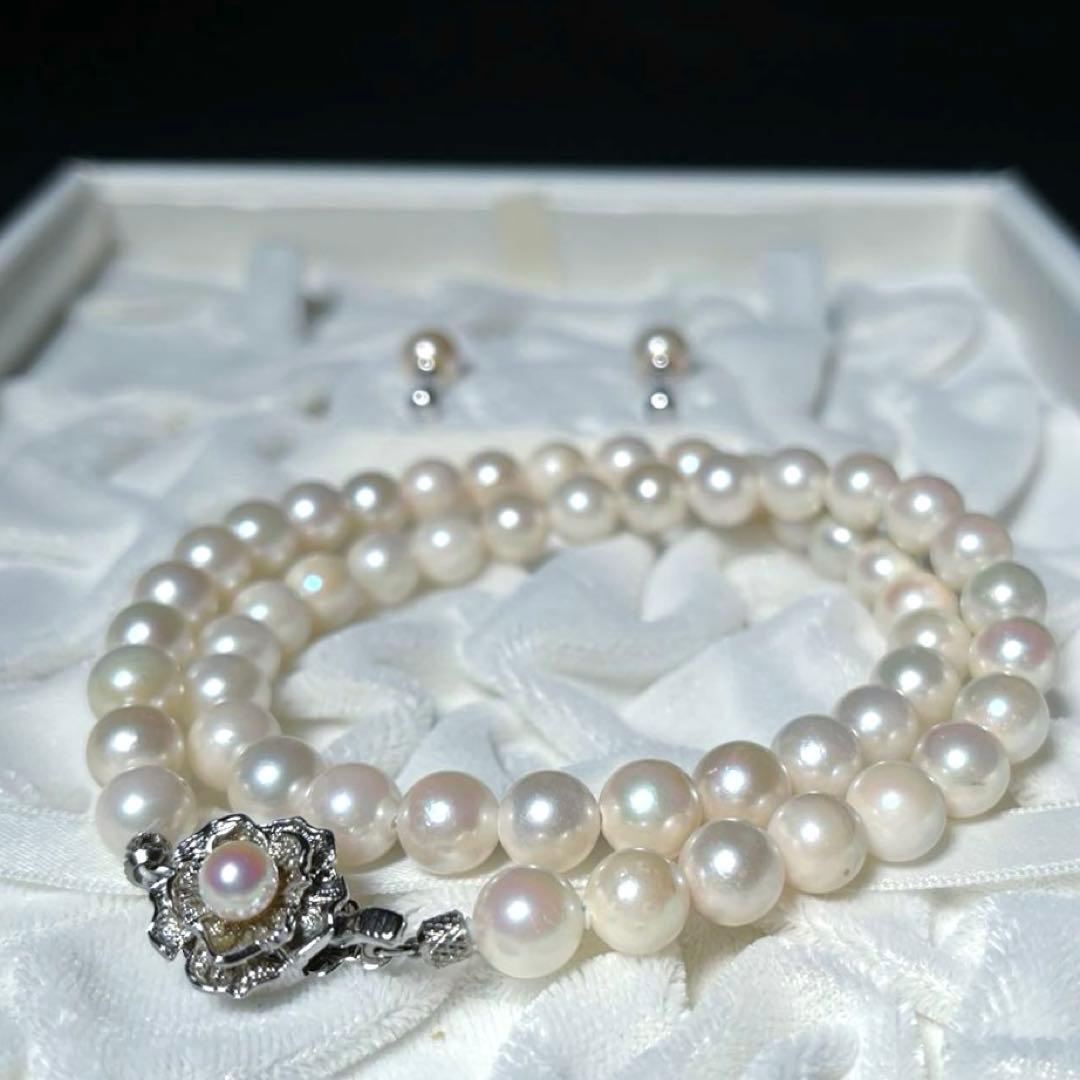 K14 Akoya pearl necklace and matching earrings with round 7.5 to 8mm pearls and silver marking