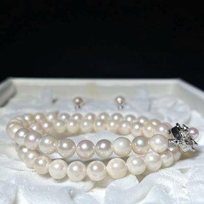 K14 Akoya pearl necklace and matching earrings with round 7.5 to 8mm pearls and silver marking