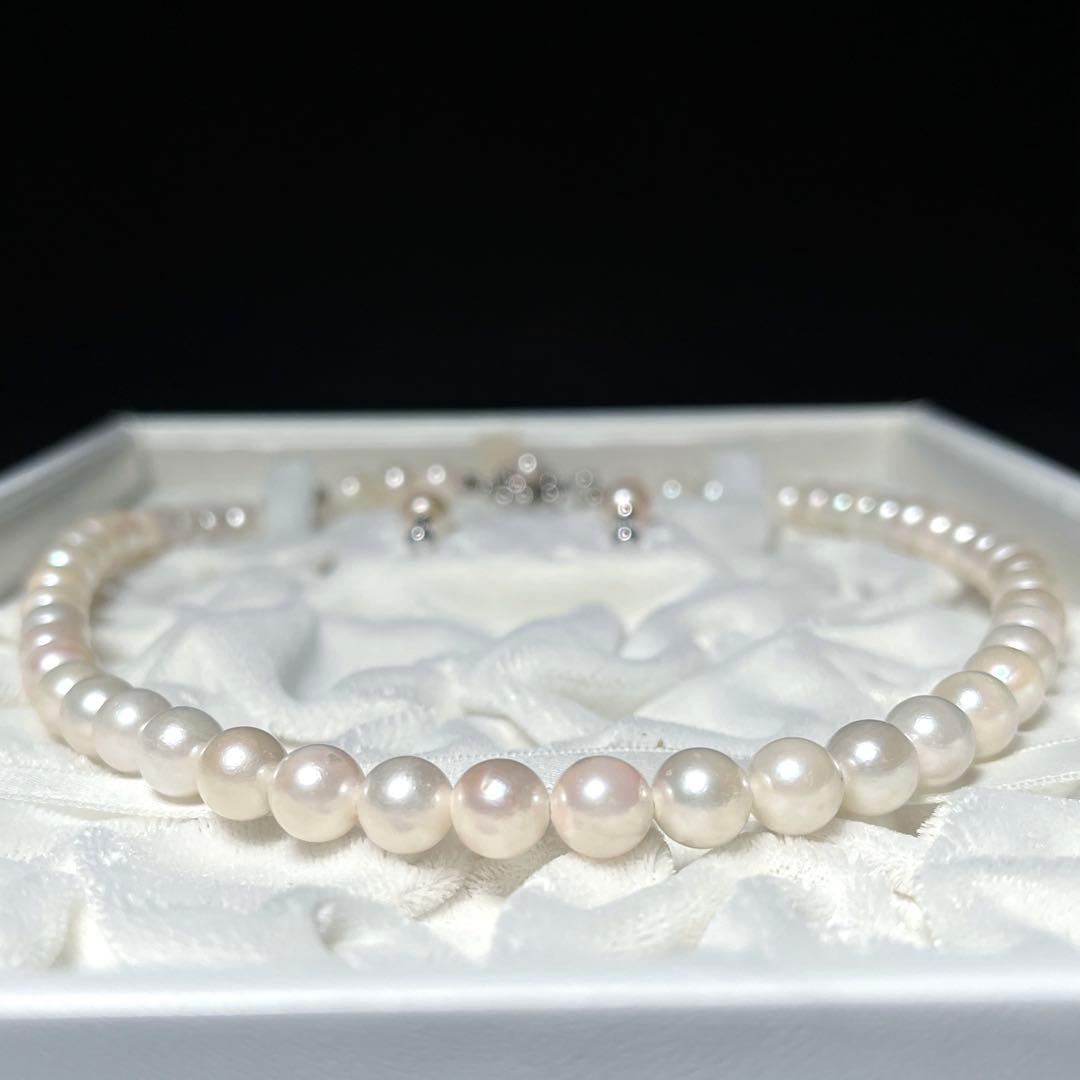 K14 Akoya pearl necklace and matching earrings with round 7.5 to 8mm pearls and silver marking