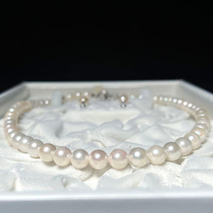 K14 Akoya pearl necklace and matching earrings with round 7.5 to 8mm pearls and silver marking