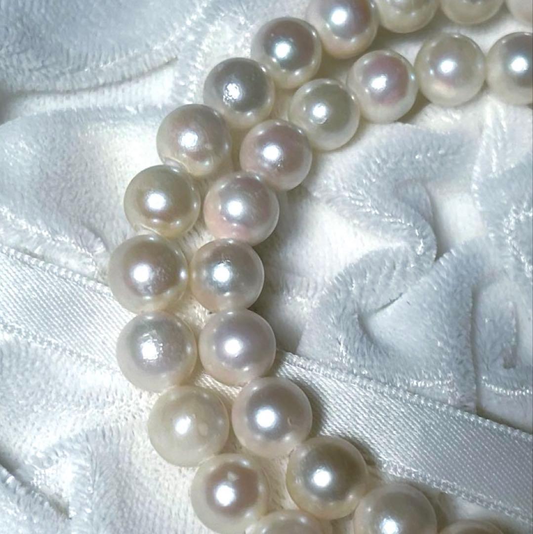 K14 Akoya pearl necklace and matching earrings with round 7.5 to 8mm pearls and silver marking