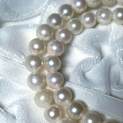 K14 Akoya pearl necklace and matching earrings with round 7.5 to 8mm pearls and silver marking