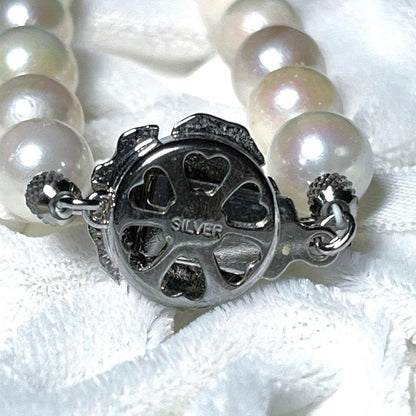 K14 Akoya pearl necklace and matching earrings with round 7.5 to 8mm pearls and silver marking