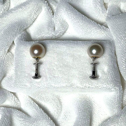 K14 Akoya pearl necklace and matching earrings with round 7.5 to 8mm pearls and silver marking