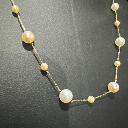Perlagione Akoya baby pearl necklace in 14K gold with 42 cm length displayed on a jewelry stand