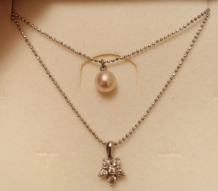 New Akoya pearl two-strand necklace featuring 7mm pink white round pearls and 6 round cut cubic zirconia stones