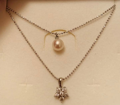 New Akoya pearl two-strand necklace featuring 7mm pink white round pearls and 6 round cut cubic zirconia stones
