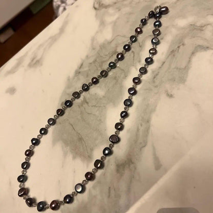 Multi-color freshwater pearl lariat necklace measuring 62 cm displayed against white background
