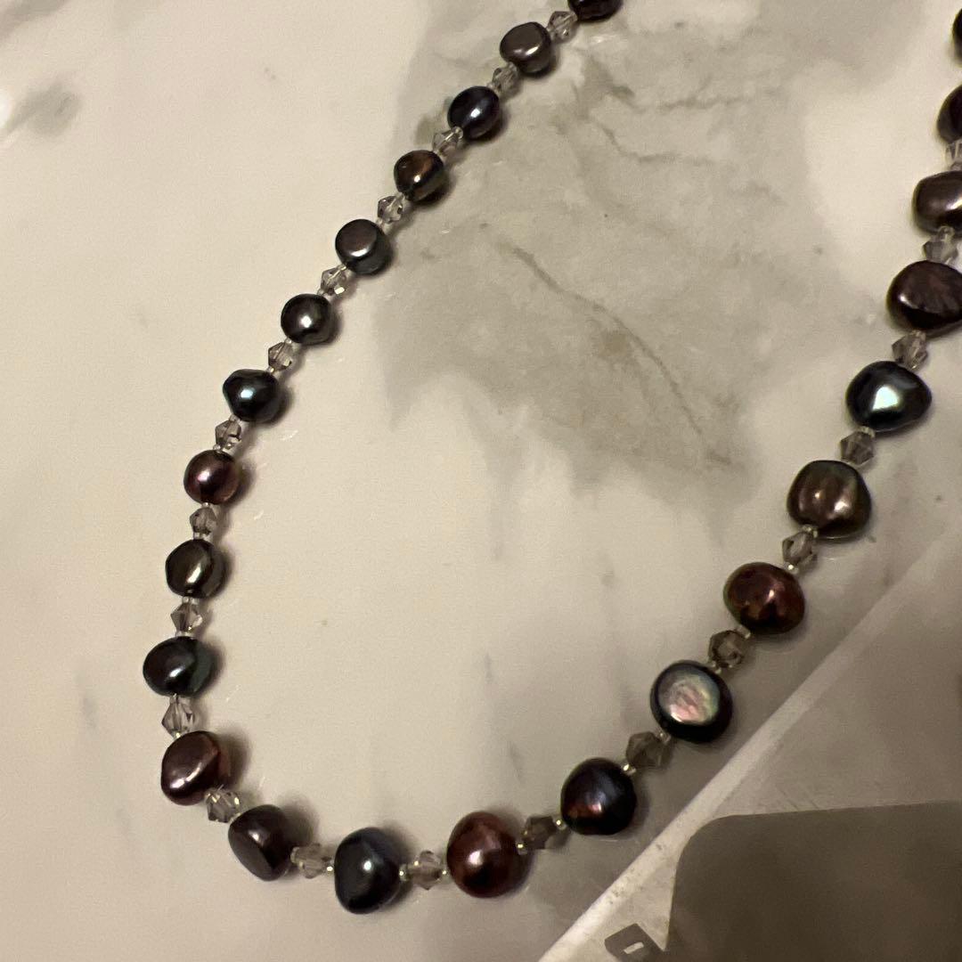 Multi-color freshwater pearl lariat necklace measuring 62 cm displayed against white background