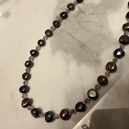 Multi-color freshwater pearl lariat necklace measuring 62 cm displayed against white background
