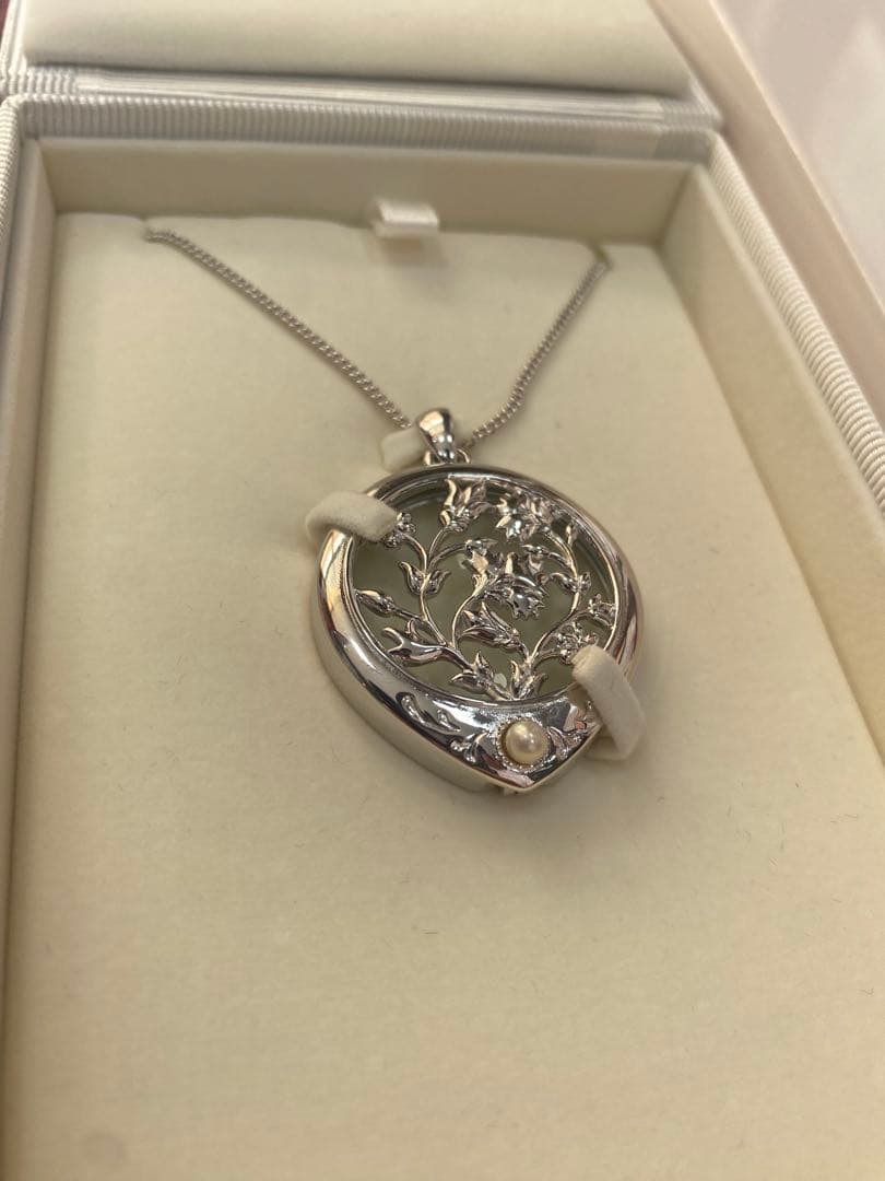 Mikimoto Loupe Pearl Necklace displayed with pearls and elegant design on a white background