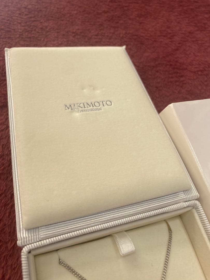 Mikimoto Loupe Pearl Necklace displayed with pearls and elegant design on a white background